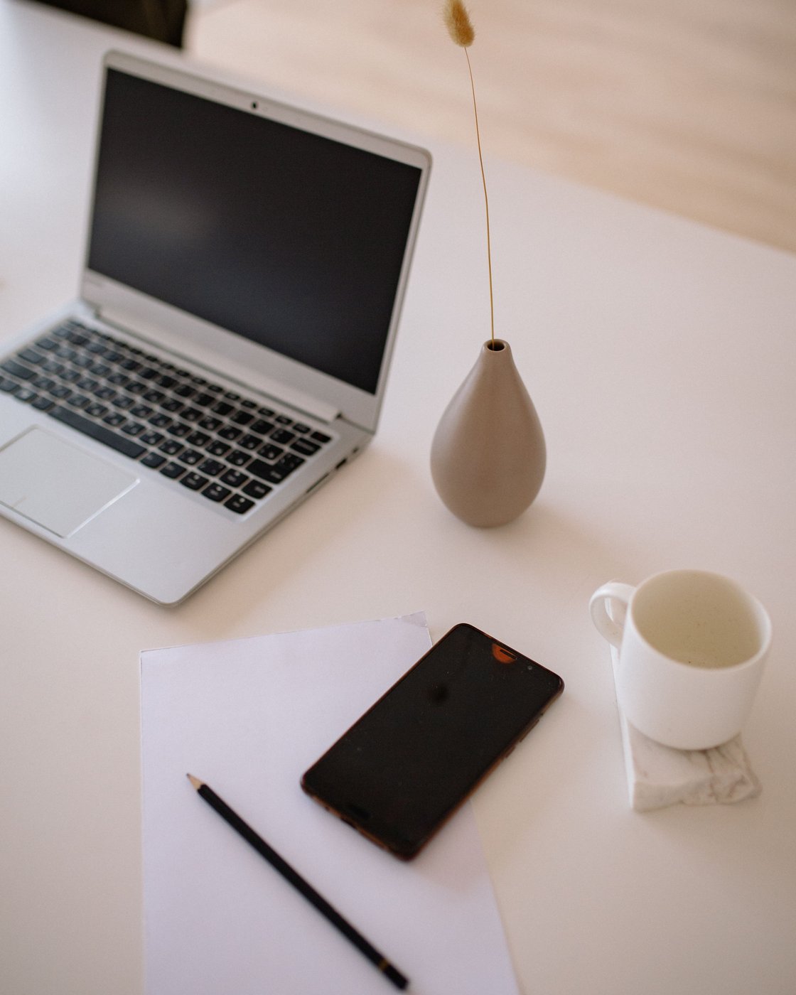 Working space with laptop and notebook